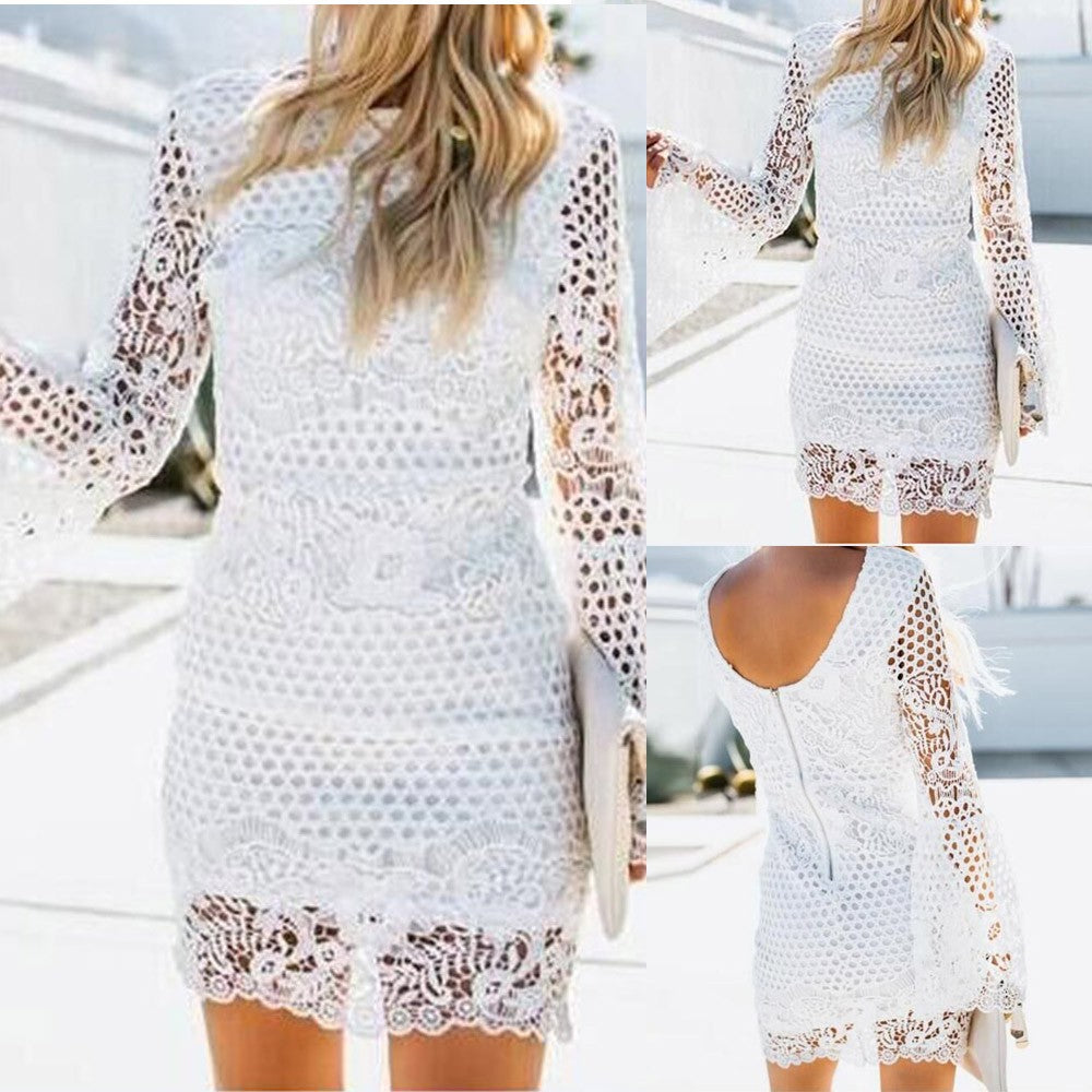 Vestido de Cocktail manga larga de encaje.